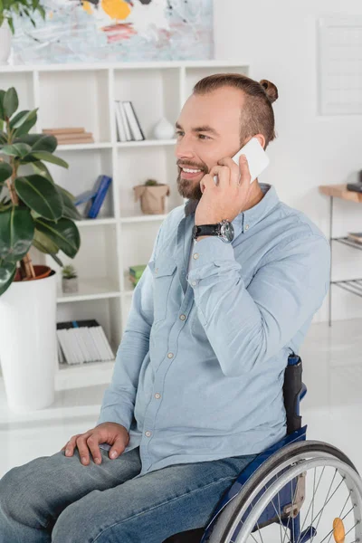 Disabled man talking by phone — Stock Photo