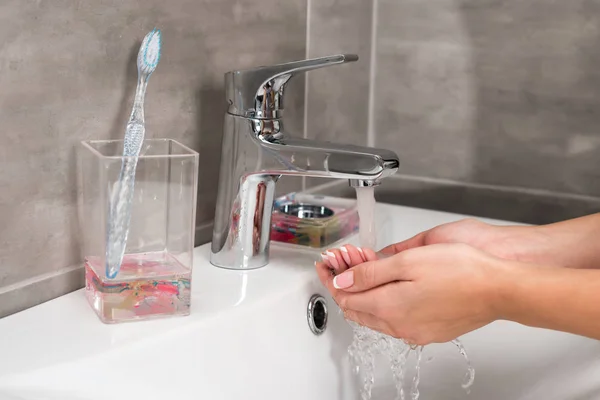 Woman washing hands — Stock Photo