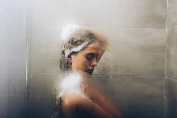 Woman washing hair — Stock Photo