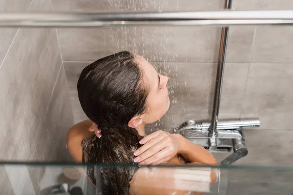 Girl taking shower — Stock Photo