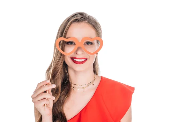 Girl with heart shaped glasses on stick — Stock Photo