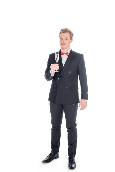 Man in suit with glass of champagne — Stock Photo