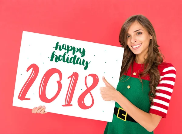 Woman in elf costume with banner — Stock Photo