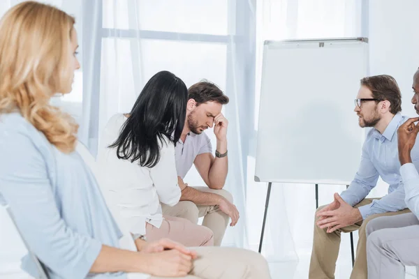 Middle aged multiethnic people supporting each other during group therapy — Stock Photo