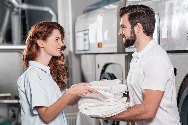 Dry cleaning managers working together at laundry — Stock Photo