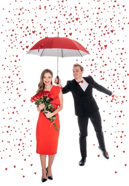 Paar mit Regenschirm und Rosen — Stockfoto