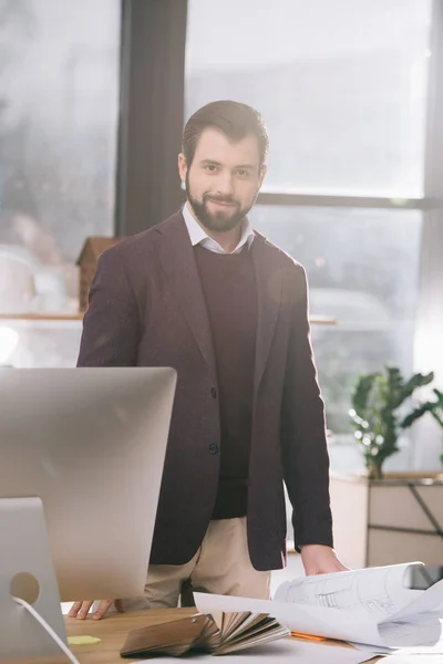 Handsome architect working in modern office — Stock Photo
