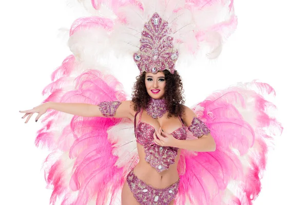 Mulher atraente dançando em traje de carnaval tradicional com penas rosa, isolado em branco — Stock Photo
