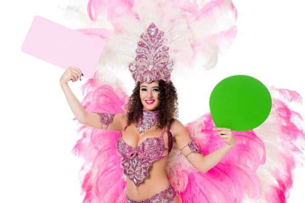 Woman in carnival costume holding blank green text balloon and pink banner, isolated on white — Stock Photo