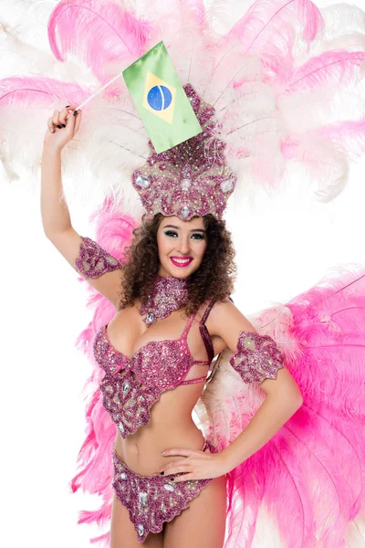 Smiling woman in carnival costume holding brazilian fllag in raised hand, isolated on white — Stock Photo