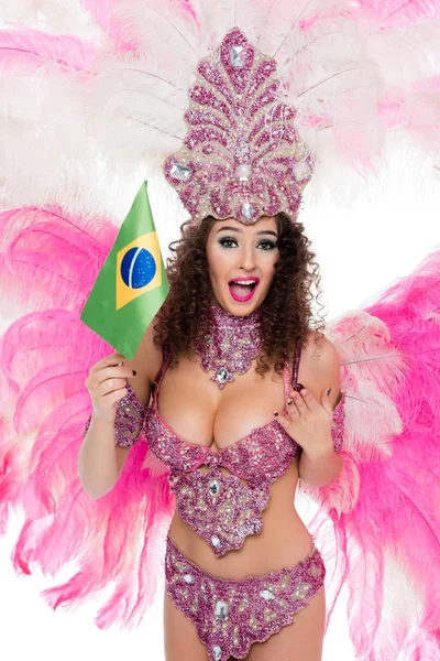 Smiling woman in carnival costume holding brazilian fllag in hand, isolated on white — Stock Photo