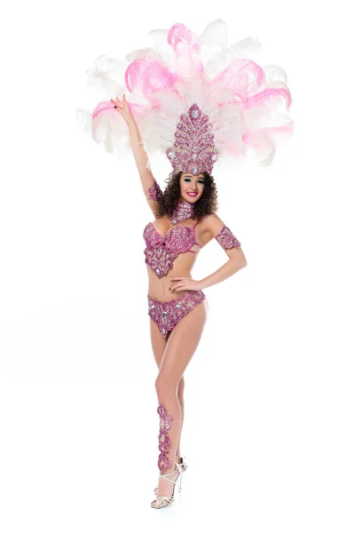 Happy young woman in carnival costume with pink feathers isolated on white — Stock Photo