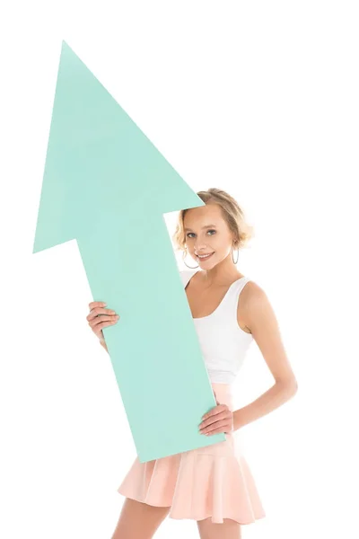 Portrait of smiling young woman with arrow isolated on white — Stock Photo