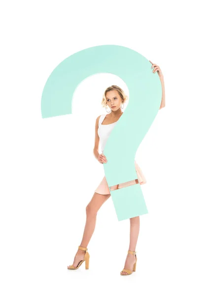 Young woman with big question mark in hands looking at camera isolated on white — Stock Photo