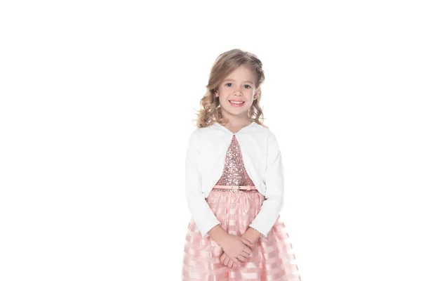Entzückend lächelndes Kind in rosa Kleid, isoliert auf weiß — Stockfoto