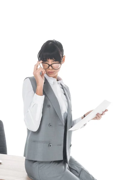 Businesswoman looking above glasses isolated on white — Stock Photo