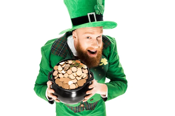 Excited leprechaun in green suit and hat holding pot of gold, isolated on white — Stock Photo