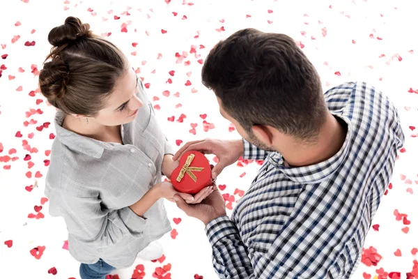 Overhead view of girlfriend giving boyfriend present box isolated on white, valentines day concept — Stock Photo