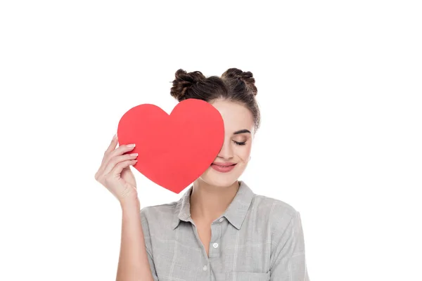 Girl covering eye with red paper heart isolated on white, valentines day concept — Stock Photo