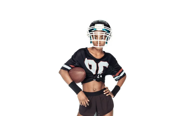 Stylish female american football player with ball looking at camera isolated on white — Stock Photo