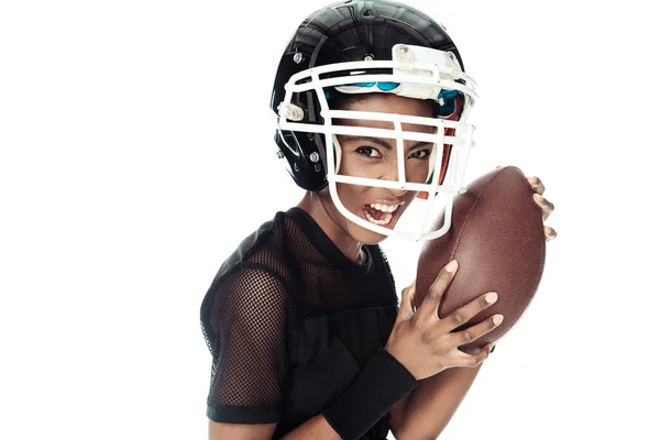 Close-up portrait of emotional female american football player with ball and in helmet isolated on white — Stock Photo