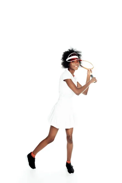 Happy young female tennis player preparing to serve isolated on white — Stock Photo