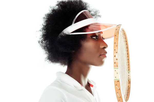 Close-up portrait of concentrated young female tennis player with racket isolated on white — Stock Photo