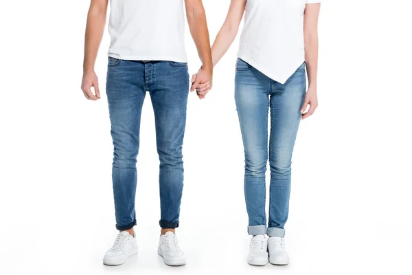 Low section view of couple holding hands, isolated on white — Stock Photo