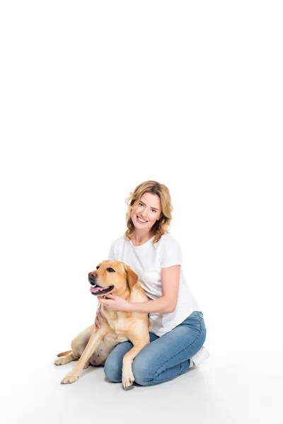 Cheerful woman with golden retriever dog, isolated on white — Stock Photo