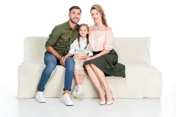 Família feliz descansando no sofá juntos isolados no branco — Fotografia de Stock