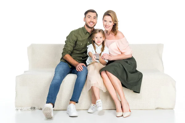 Sonriente familia viendo tv juntos aislado en blanco - foto de stock