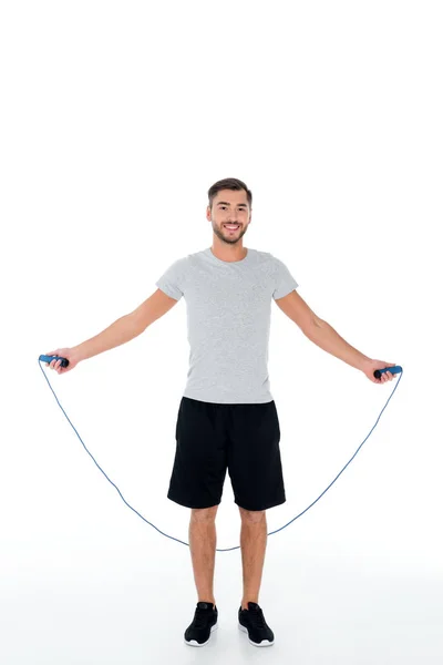 Attraente sportivo con corda di salto esercizio isolato su bianco — Foto stock