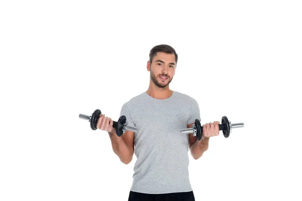 Portrait of sportsman exercising with dumbbells isolated on white — Stock Photo