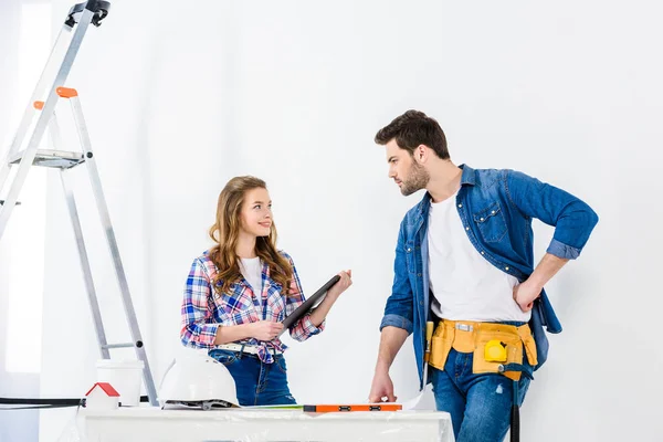 Couple looking at each other during home repair — Stock Photo