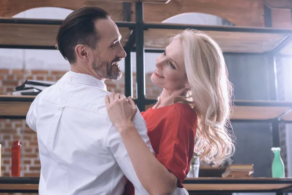 Happy wife and husband dancing at home — Stock Photo