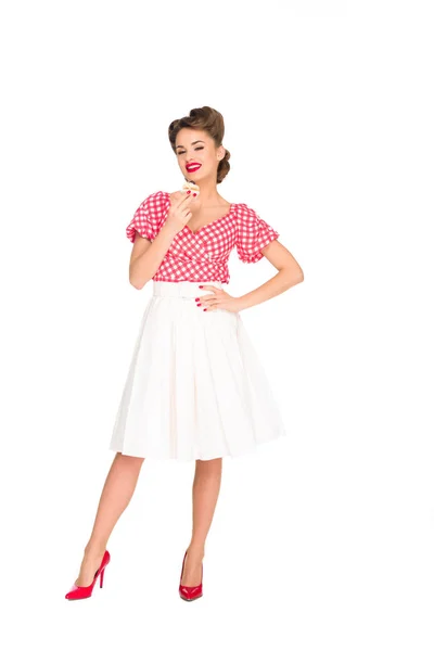 Beautiful smiling woman in pin up clothing with cupcake isolated on white — Stock Photo