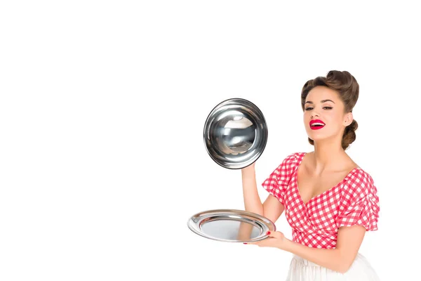 Beautiful young woman in retro clothing with empty serving tray in hands isolated on white — Stock Photo