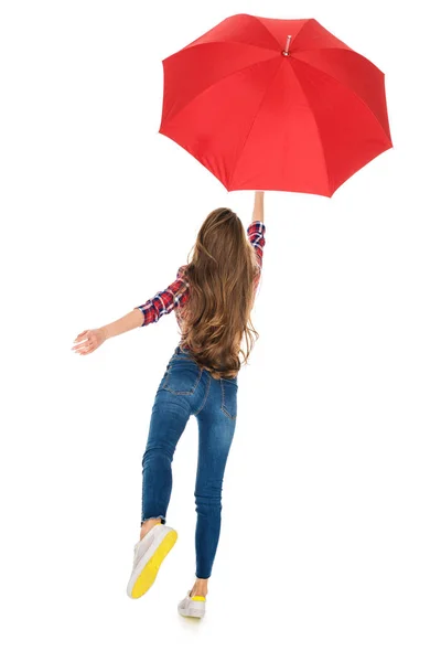 Vue arrière de fille tenant parapluie rouge isolé sur blanc — Photo de stock