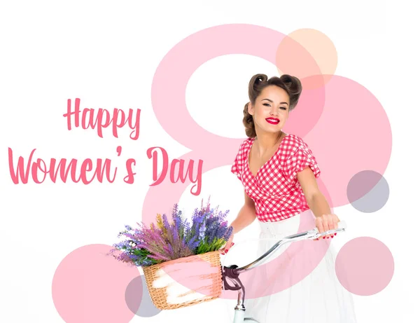 Glückliche Glückwunschkarte zum Frauentag mit attraktiver Pin-up-Frau auf Fahrrad mit Blumenkorb auf weißem Hintergrund — Stockfoto