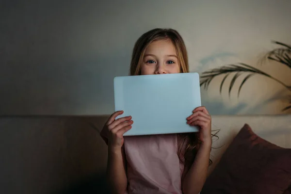 Obscured view of little kid with tablet at home — Stock Photo