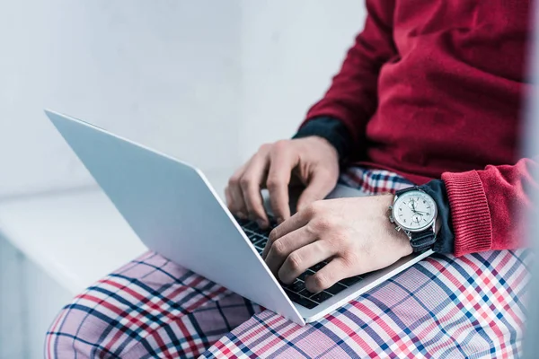 Partial view of businessman working on laptop — Stock Photo