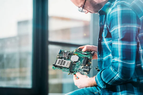 Hardware engineer working with circuit board — Stock Photo