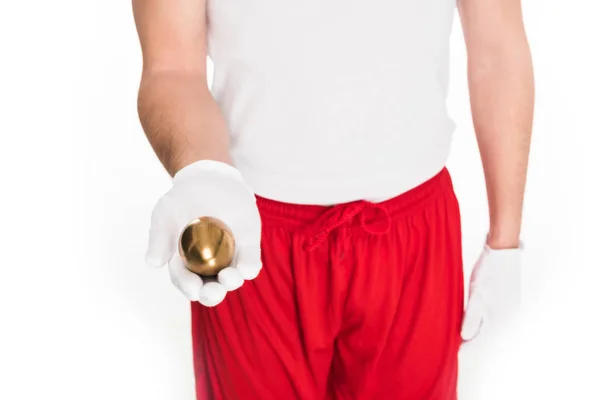 Partial view of man holding golden egg in hand isolated on white, easter concept — Stock Photo