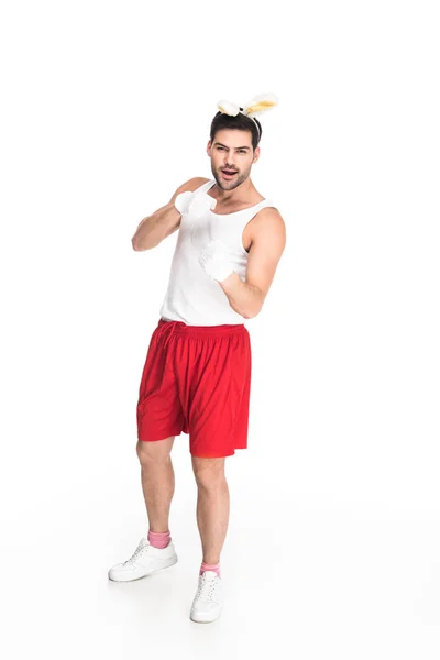 Jeune homme avec des oreilles de lapin isolé sur blanc, concept de Pâques — Photo de stock