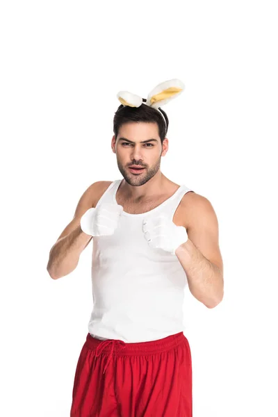 Homme aux oreilles de lapin isolé sur blanc, concept de Pâques — Photo de stock