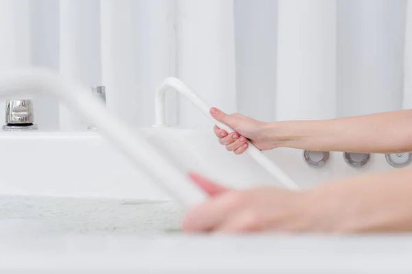 Partial view of woman taking hydro bath in spa salon — Stock Photo