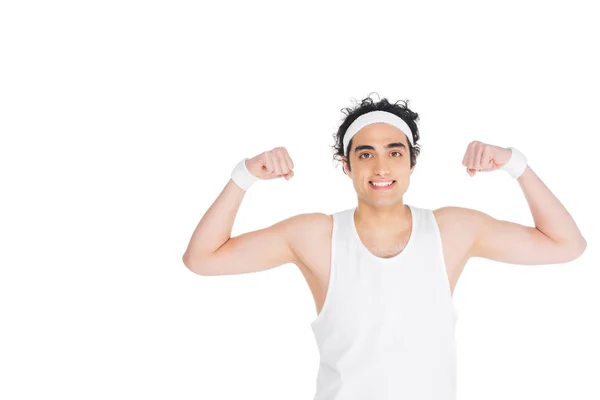 Giovane uomo magro in singoletto mostrando muscoli isolati su bianco — Foto stock