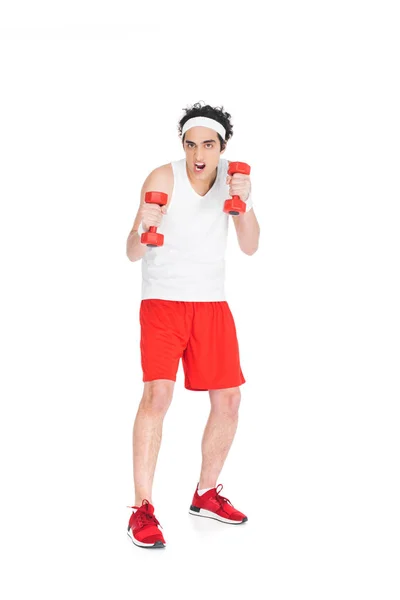 Homem magro em sporstwear exercício com halteres isolados em branco — Fotografia de Stock