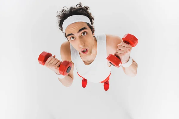 High angle view of thin sportsman with dumbbells isolated on white — Stock Photo