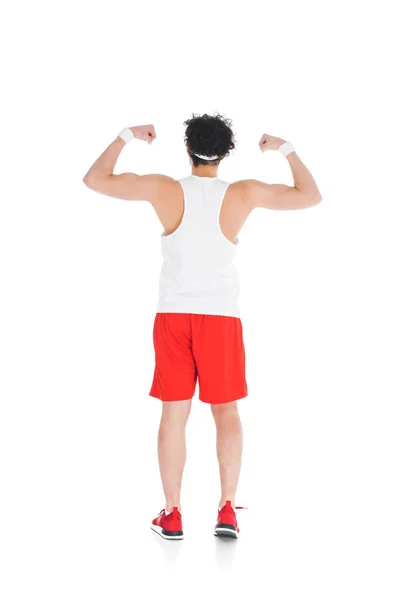 Visão traseira de esportista magro mostrando músculos em mãos isoladas em branco — Fotografia de Stock